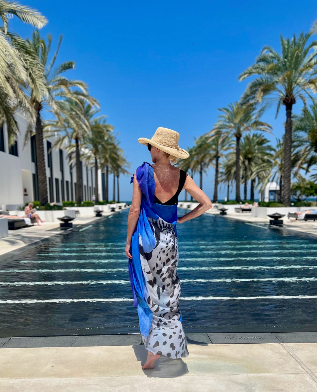 WEARING THE SCARF-SARONG COLLECTION AT THE CHEDI MUSCAT, OMAN.